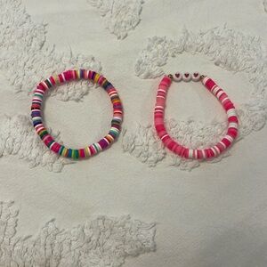 This is a homemade clay bead to pack bracket set. (Hot pink)